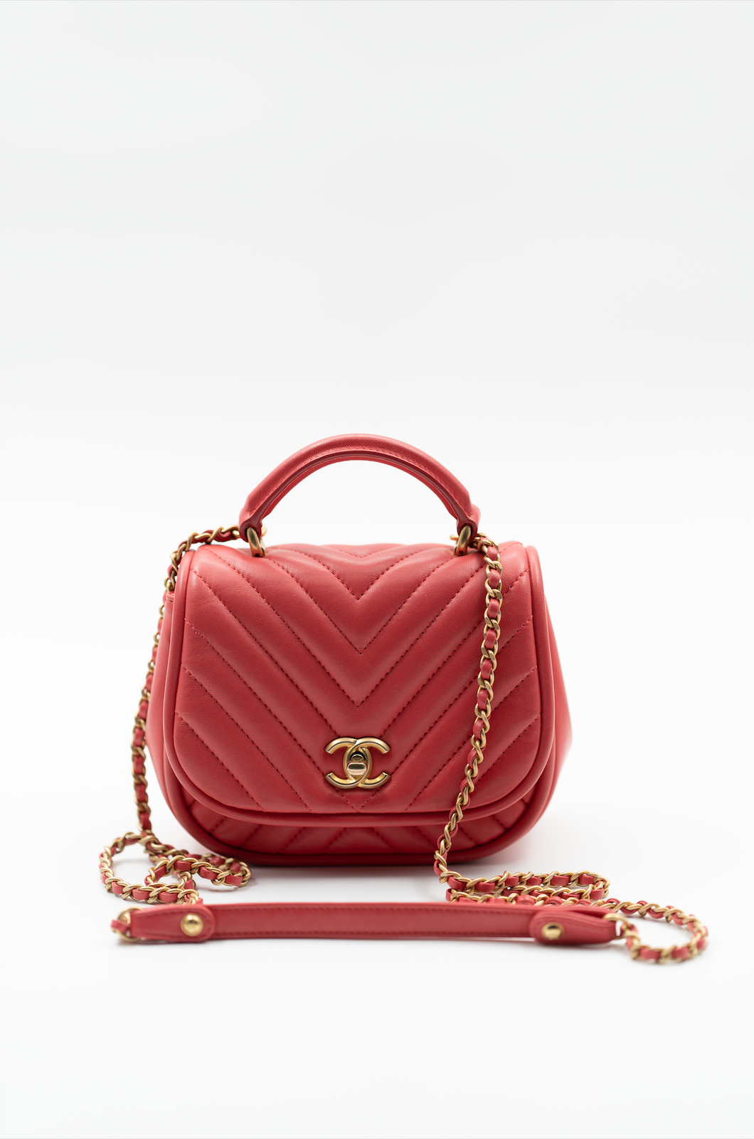 Chanel 2017 reversed chevron round flap bag in coral