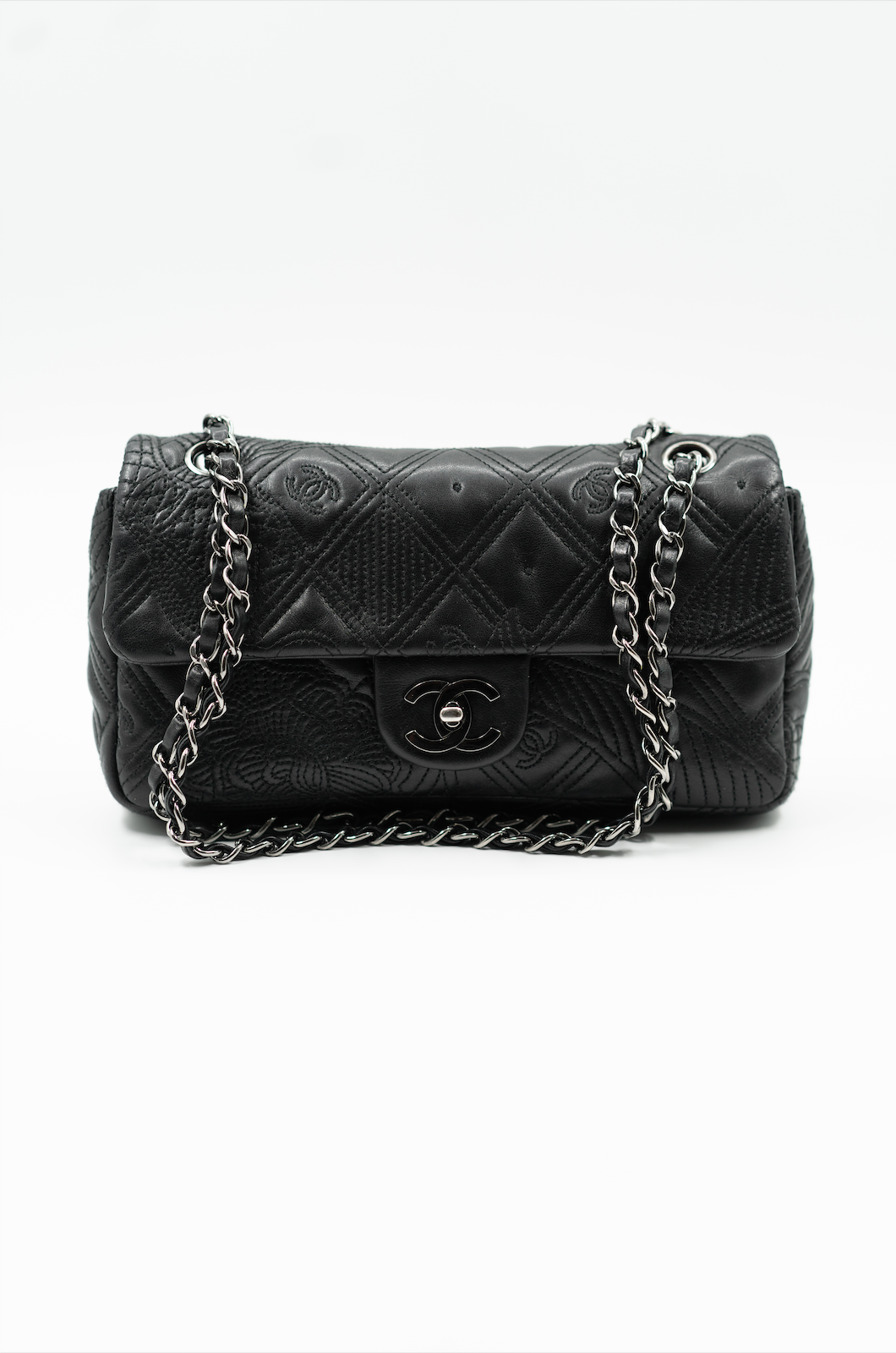 Chanel embossed single flap bag black Pleasure Paris